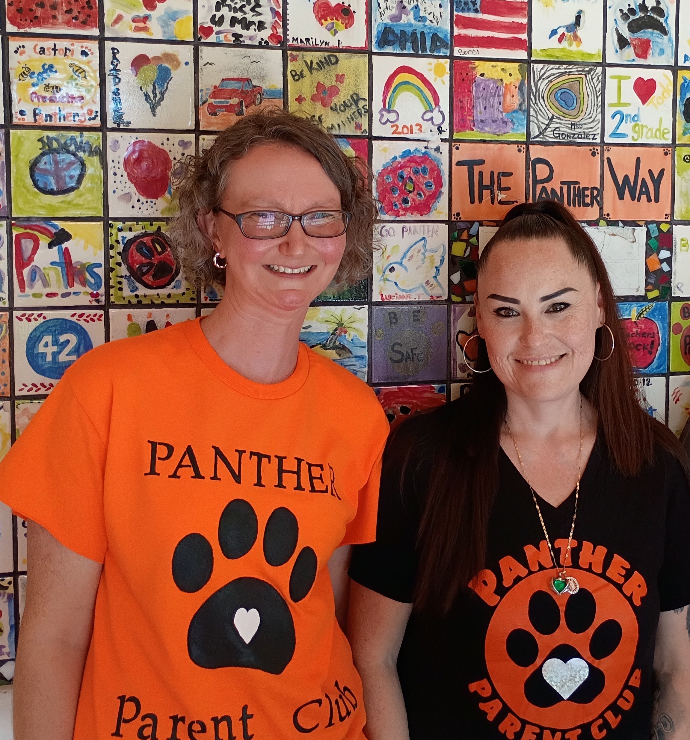 Lana Sotoy Karen Elliott and Lana Sotoy standing in front of student art mural